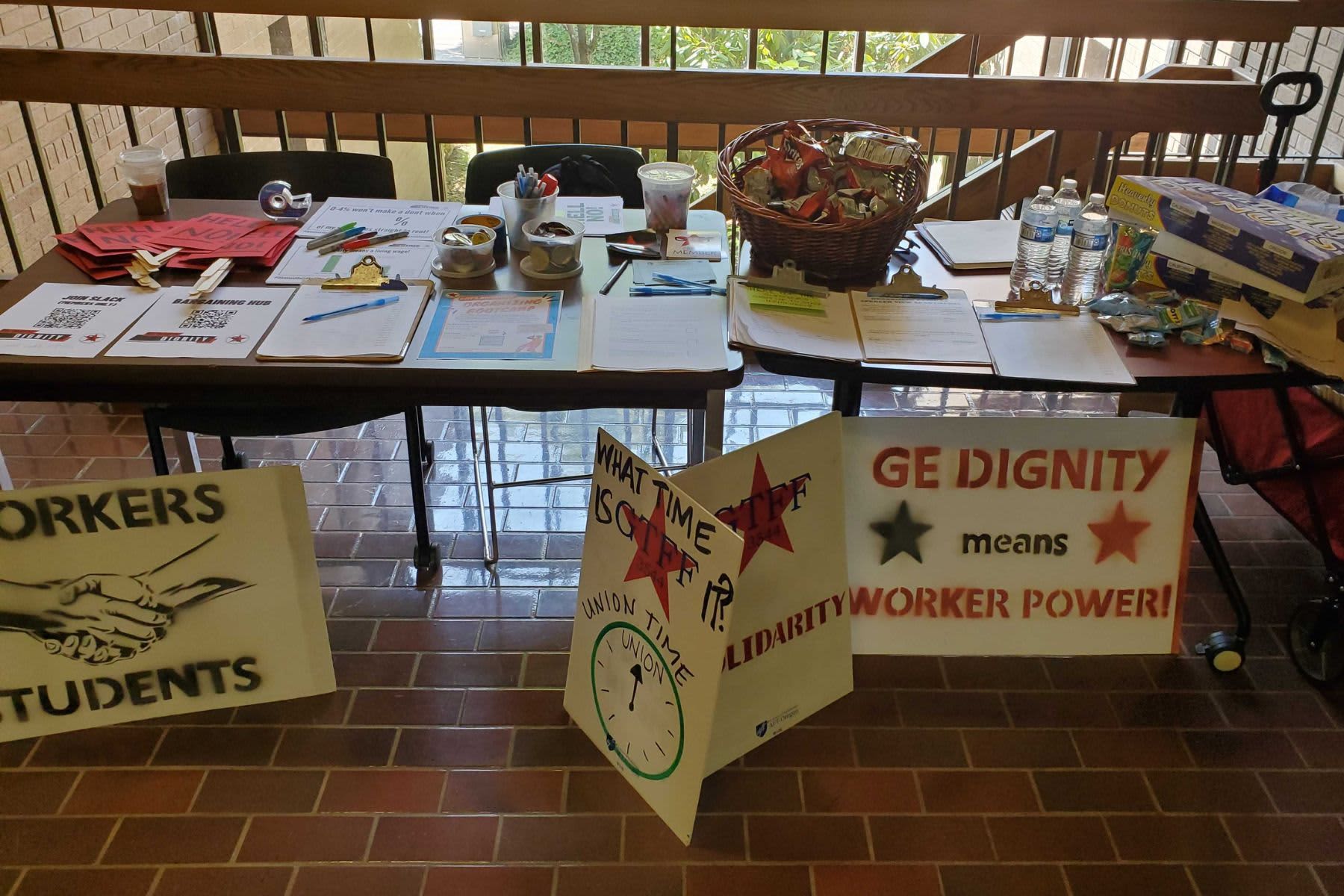 GTFF campus info station, with signs promoting union solidarity