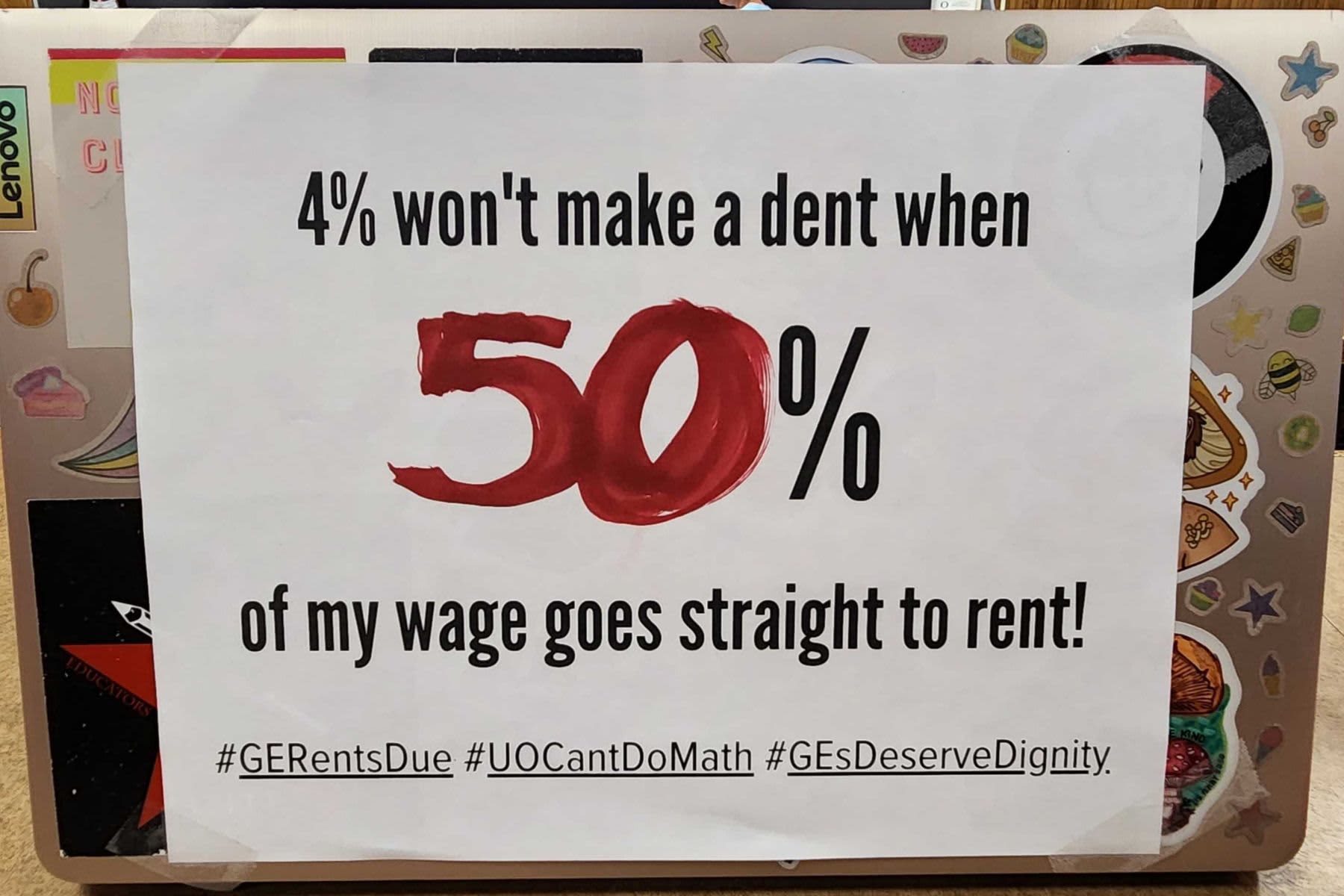 GTFF campaign laptop sign, which reads 4% won't make a dent when 50% of my wage goes straight to rent