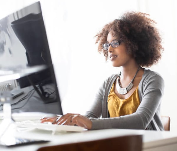 Portrait of a young women programming at a startup. Image Credit: alvarez / E+ / Getty Images