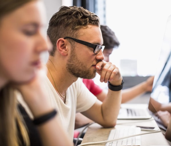 People working on computers in computer lab
