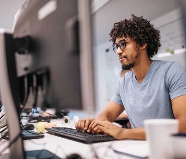 Man typing on computer keyboard