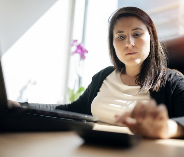 Businesswoman using calculator