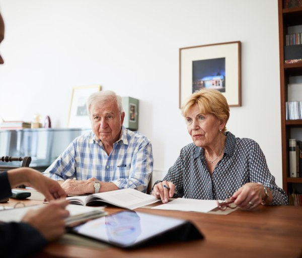 Elderly couple meeting with financial professional