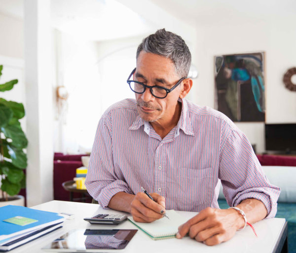 Man doing math at home office