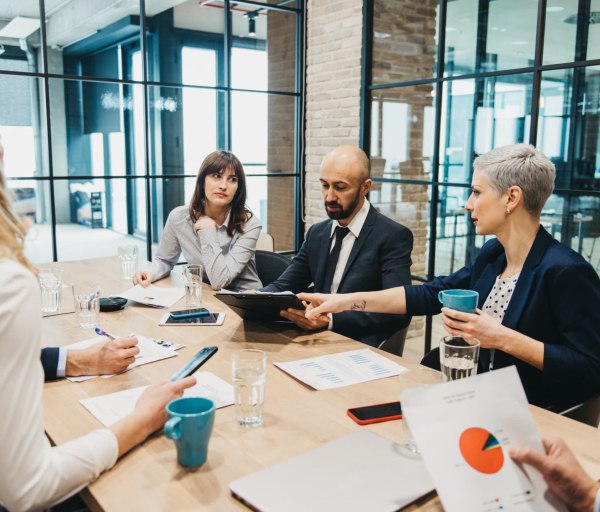 People at table having business meeting