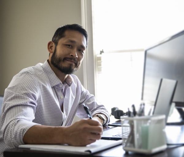 Man working on laptop in home office