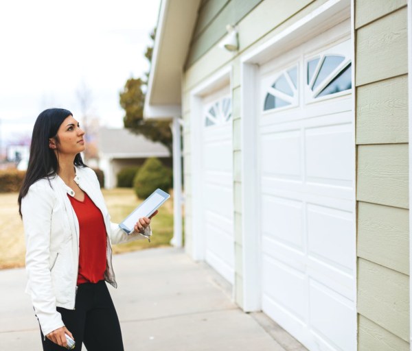 Woman inspecting garage during home appraisal