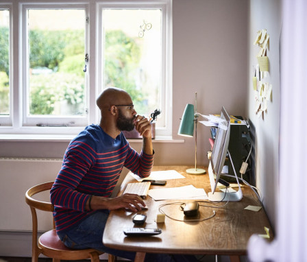 Man working on computer at home