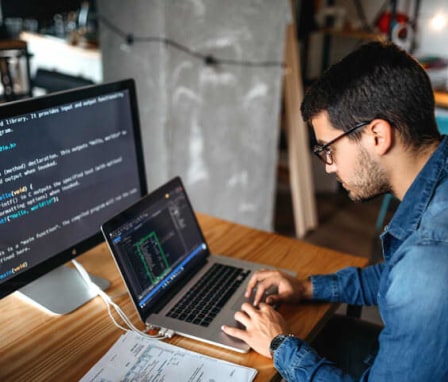 Male programmer coding at home. Image Credit: Creative DJ / E+ / Getty Images
