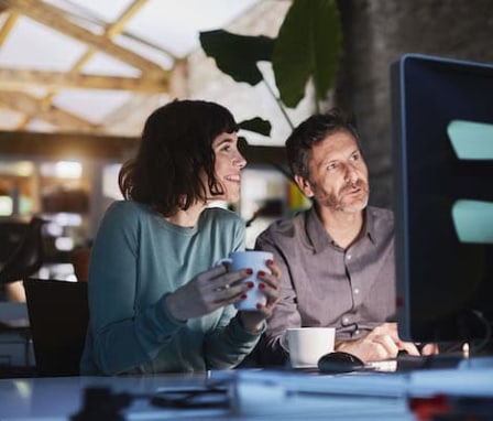 Man and woman working together on a computer