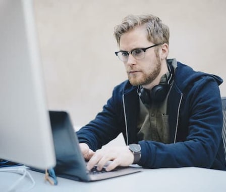 Man typing on laptop