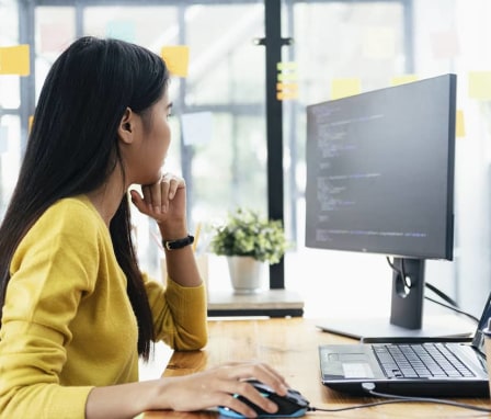 Woman using computer mouse