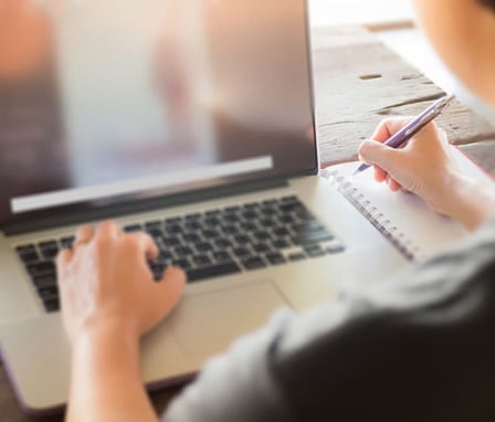 Laptop and notepad