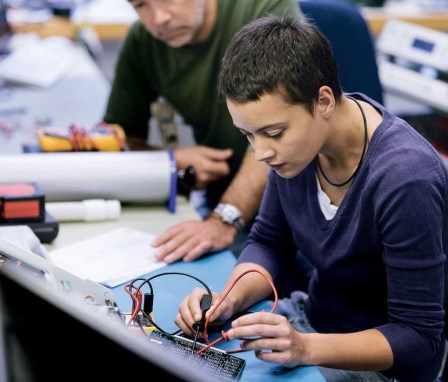 Women working on conductor board