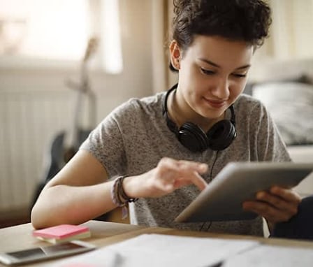 Woman touching tablet screen