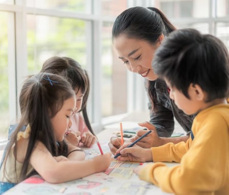 Elementary teacher with three students