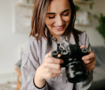 Woman looking at camera screen