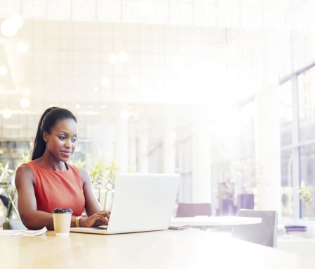 Woman working on laptop in office