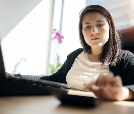 Businesswoman using calculator