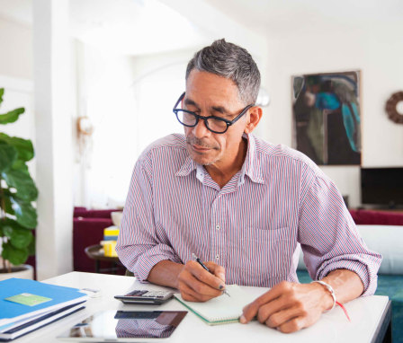 Man doing math at home office