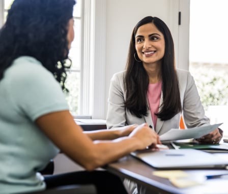 Business person talking to client in office