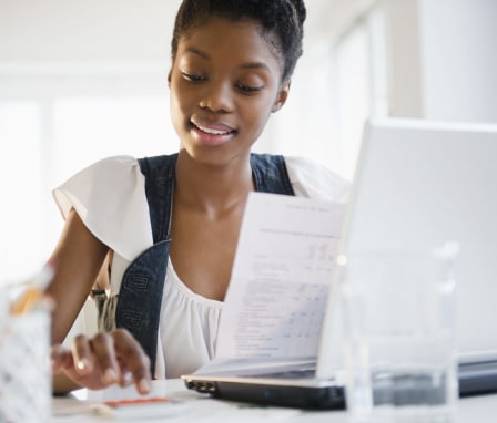 Young woman paying bills online