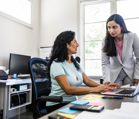 Two women talking in an office
