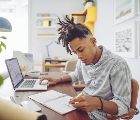 Man working at desk on laptop