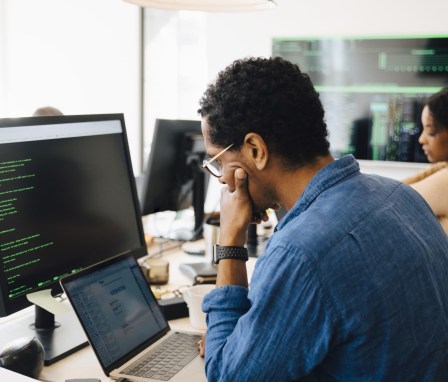 Person coding a website on a computer