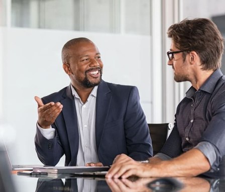Two business men talking in an office