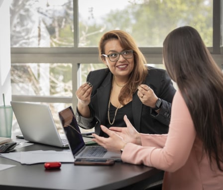 Professional Latina woman helping client