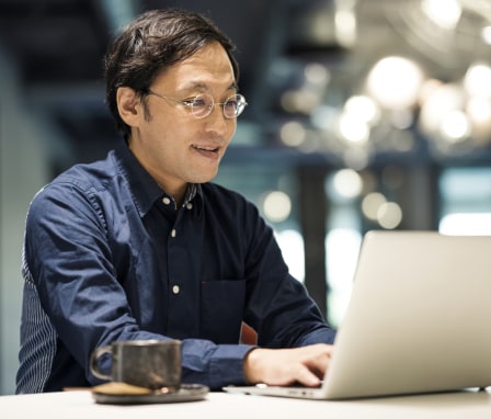 Businessman typing on laptop