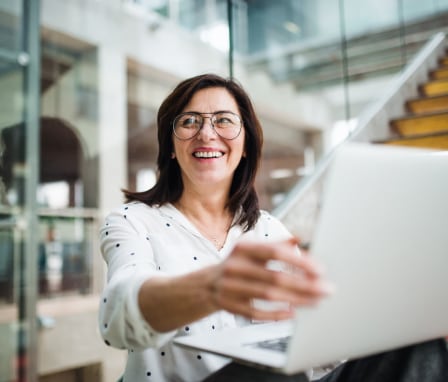 Business woman using laptop in office