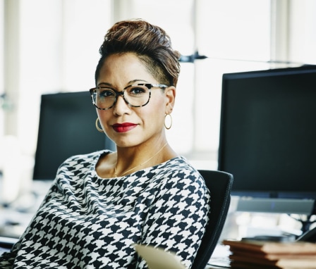 Professional woman seated at a computer
