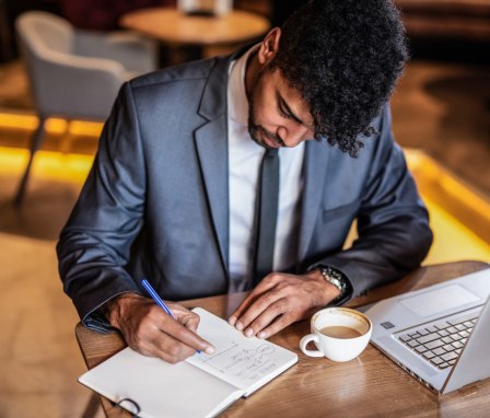 Young businessman taking notes