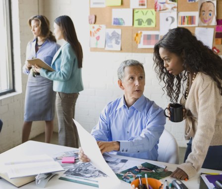 Marketing colleagues meeting in colorful office space