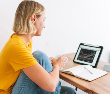 Woman tracking graph on laptop