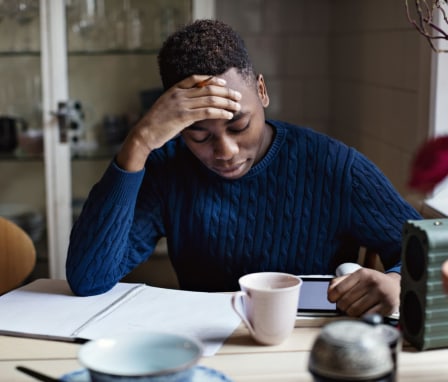 Young person studying in notebook