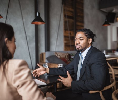 Two professionals meeting in a cafe