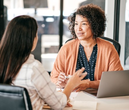 Woman interviewing a candidate in a professional office