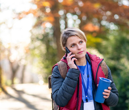 Female nursing student walking outdoors on her way to school. Image credit: Halfpoint / Shutterstock