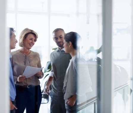 Business colleagues standing and talking together