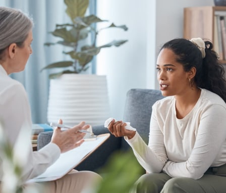 Psychologist talking to patient