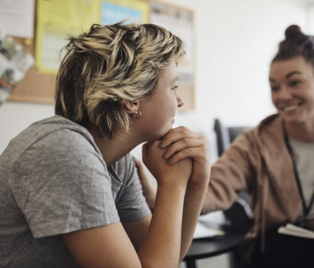 Behavioral counselor talking to teen