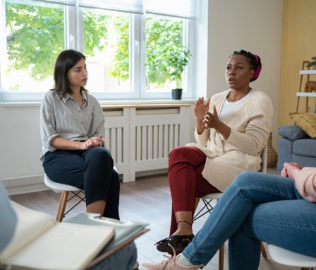 Counselor speaking in group therapy session