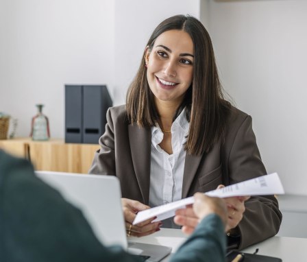 Human resources manager talks to employee