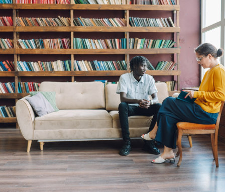 Psychologist talking to patient in office