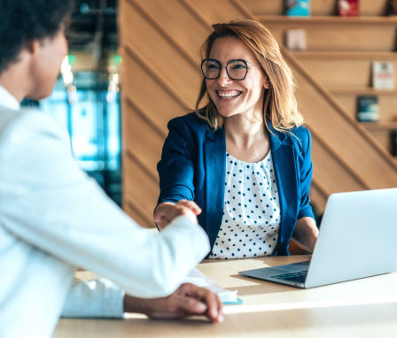 Social psychologist shaking hands with colleague