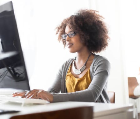 Portrait of a young women programming at a startup. Image Credit: alvarez / E+ / Getty Images