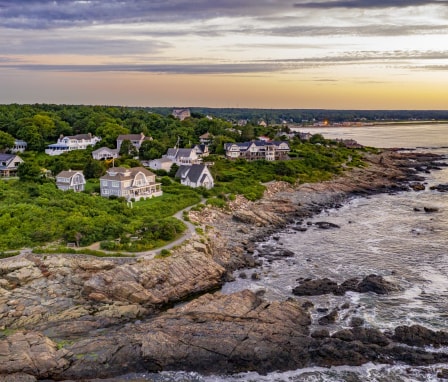 Houses on the coast of Maine at sunset